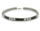 Sterling silver black diamond tennis bracelet with 50 alternating black and white diamonds.  Diamond content is 1 carat in  J/K color I2 clarity.  Two star diamonds.