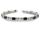 Spruce up any outfit with this sterling silver sapphire and diamond bracelet with a total gem weight of 7 1/2 carats.  Diamond content is .02 carat in I/J color, I1 clarity.  Two star diamonds.