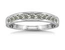 If you're looking for the perfect compliment to your diamond engagement ring, then look no further. This 10 karat white gold, twelve diamond channel set wedding band is exactly what you have been searching for!  Diamond content is 1/2 carat in J/K color, I2/I3 clarity.  One star diamonds.
