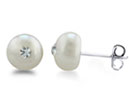 These sophisticated pearl  stud earrings combine the classic pearl stud look with a modern twist by adding two shimmering Swarovski crystals.  Look closely, these cultured freshwater pearl studs have a fiery Swarovski crystal drilled into the middle, as if the pearl has grown around the stone.