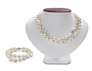 An incredibly elegant look for a ridiculous price.  The necklace features 72 very large 10mm biwa pearls, and the bracelet features 34 white beautiful pearls.  Both the necklace and the bracelet feature a 925 sterling silver flower clasp with a slide lock.