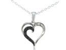 Let her know she's loved with this subtle and sweet black and white diamond heart pendant in sterling silver. Diamond Content is .08 carat in I/J color, I2 clarity. Two Star Diamonds.