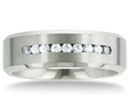 This beautiful comfort fit ring is 8mm wide. It is matte finish with 9 large channel set Cubic Zirconia. All of our titanium rings are cobalt free and hypoallergenic. Titanium at Superjeweler.com will not cause skin irritations. Due to the hardness of titanium, these rings can be laser engraved, but not hand engraved. All rings come with a 100% Money Back Guarantee.
