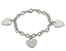 Give her a gift she'll truly love this with this dangling triple heart charm bracelet.  This pretty bracelet is made of stainless steel and features 3 dangling hearts measuring 3/4 inches.
