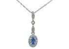 Tanzanite Jewelry: Dangle Style Tanzanite and Diamond Pendant in 10k White Gold 
