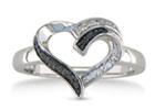 This unique sterling silver ring combines the elegance of a diamond heart with the edginess of black diamonds to create the perfect right hand ring!   This ring contains one black diamond and one white diamond.  Diamond content is .01 carat in K/L color and I2/I3 clarity.  One star diamonds
